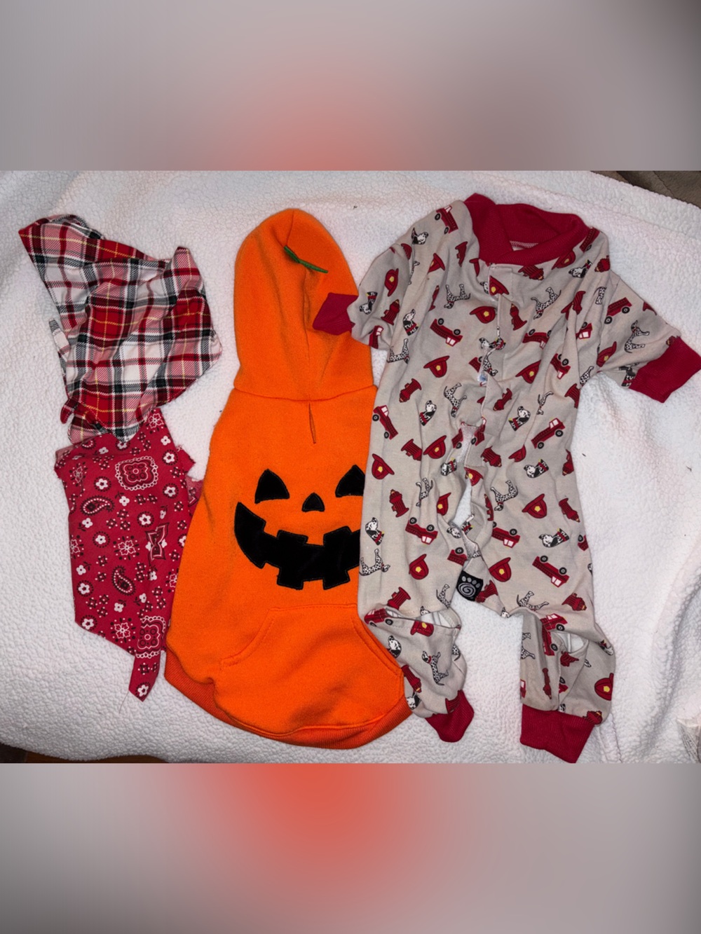 Footies, orange pumpkin hoodie, & two bandanas